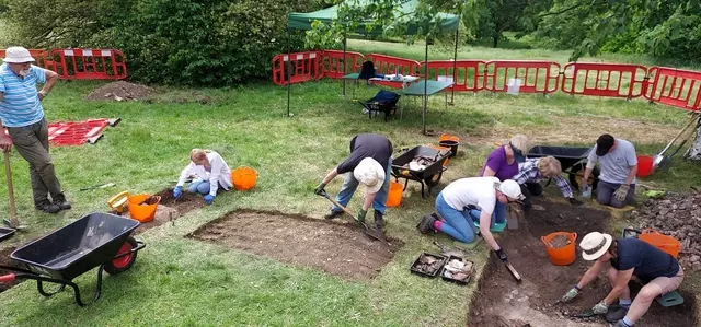 The archaeology dig at the Magnetic Observatory with volunteers digging the site.